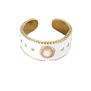 Gold wide band ring with white enamel, featuring a natural druzy stone center and dots