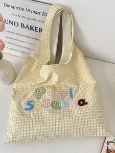 Yellow checkered canvas shoulder bag with colorful letter embroidery and casual style