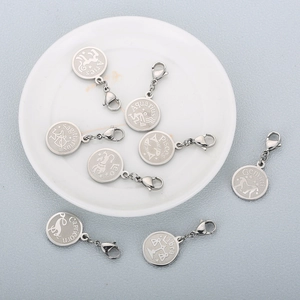 Stainless steel zodiac pendants with lobster clasps featuring engraved constellation names