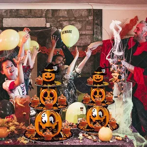 Three-tier pumpkin cake stand for Halloween parties with wizard hat and spooky faces
