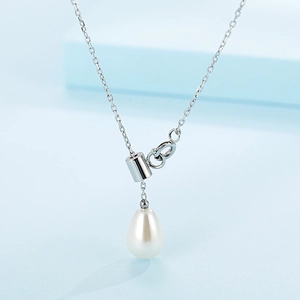Minimalist Y-shaped silver necklace with elegant water-drop pearl pendant on light blue background