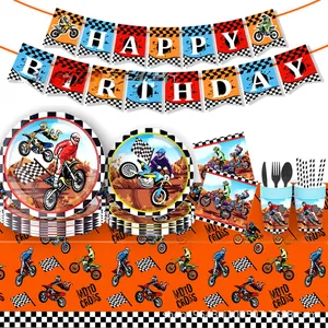 Close-up of motocross party supplies set with racing plates, napkins, and cutlery