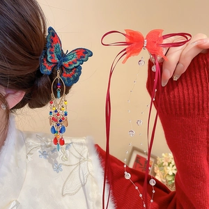 Detail of butterfly hair clip with crystal beads and elegant tassels in Chinese style