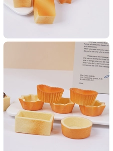 Close-up of golden geometric pastry shells in heart, star, and round shapes for DIY crafts