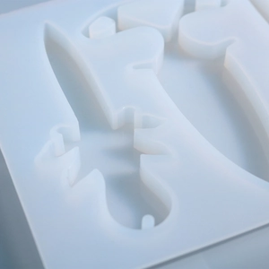 Macro shot of flexible silicone mold featuring sharp dagger and geometry cavities