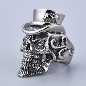 Detail of vintage silver skeleton ring with gentleman's top hat and gothic carving