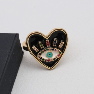Detail of heart-shaped evil eye ring with black enamel and colorful cubic zirconia