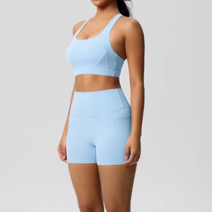 Detail shot of light blue high-waisted yoga shorts featuring a functional side phone pocket