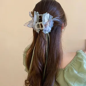 Elegant butterfly hair claw with pearls and long green ribbons for women's hairstyles