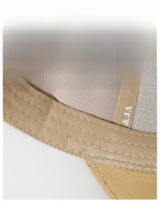 Detail view of khaki baseball cap interior showing wide sweatband and precision stitching