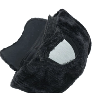 Detail of black faux fur baseball cap featuring adjustable velcro strap and soft lining