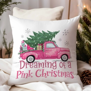 Detail of Christmas pillow cover with pink vintage truck and tree on a white base