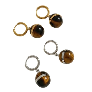 Minimalist gold and silver hoop earrings with tiger eye stone spherical pendants
