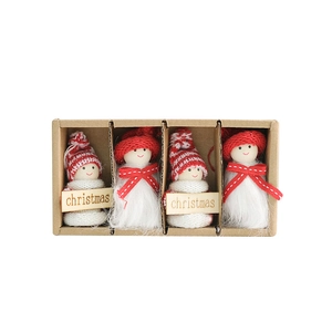 Set of four handmade Christmas dolls with wool fur and wooden elements in a gift box