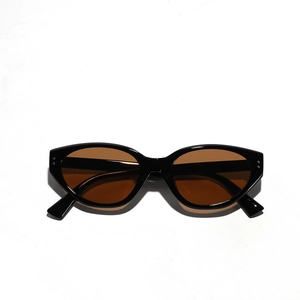 Retro black cat-eye sunglasses with brown lenses and double metal rivets on a white backdrop