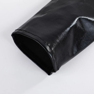 Close-up of black shiny patent leather long gloves with sleek metallic finish for performance