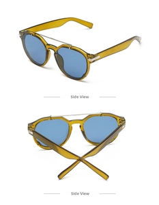 Detail view of tea brown sunglasses with double bridge and flat blue lenses