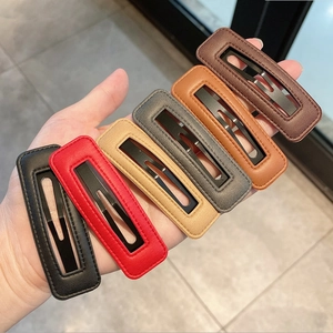 Detailed macro view of rectangular PU leather BB hair clips in various chic colors