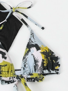 Macro detail of tropical palm tree print bikini top with high-quality stitching