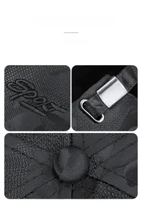Detail view of sport embroidery and silver metal adjustable buckle on black baseball cap