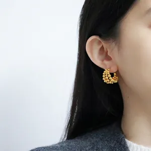 Luxurious gold-plated beaded C-shape hoop earrings for women shown on model