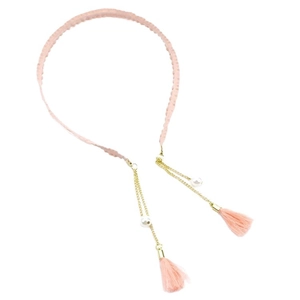 Pink woven headband with golden chains, white pearls and silk tassels in a stylish design