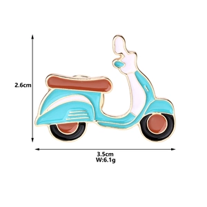 Detail view of vintage scooter brooch with teal and brown enamel glaze measurements