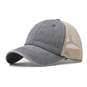 Close-up of washed cotton texture and breathable mesh on the back of the baseball cap