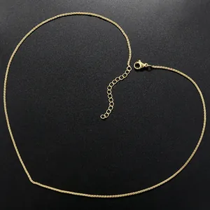 Close-up of gold chain necklace showing the adjustable extension and lobster clasp detail
