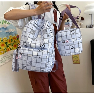 Detailed set of plaid lavender nylon backpacks including messenger bag and pencil case