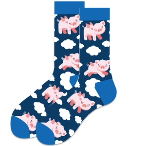 Detail of navy socks with pink flying pigs and white clouds pattern on soft fabric