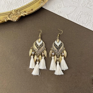 Bohemian feather earrings with white tassels and gold metal leaf in ethnic style