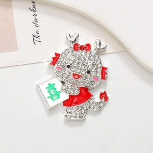 Detailed macro view of a sparkling dragon brooch with white rhinestones and red enamel