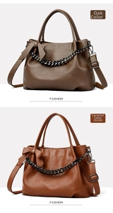 Detail view of large tote bags with decorative chains in oak and caramel leather
