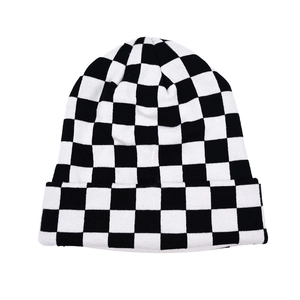 Classic black and white checkered knit beanie hat with a vintage minimalist style
