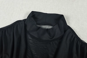 Detail of high neck black mesh dress showing sheer breathable fabric and fine stitching