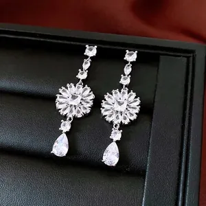 Elegant silver sunflower drop earrings with teardrop zircons in a premium jewelry box