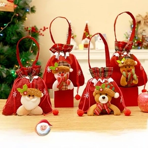 Set of four Christmas gift bags with Santa, snowman, bear, and reindeer cartoon designs