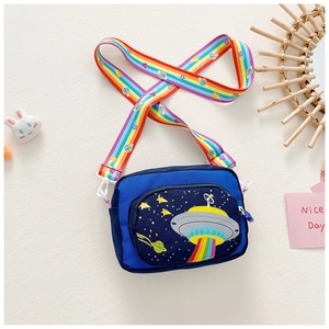 Detail view of blue kids crossbody bag with UFO pattern and rainbow shoulder strap