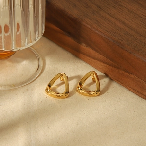 Minimalist 18k gold plated geometric triangle stud earrings on textured fabric