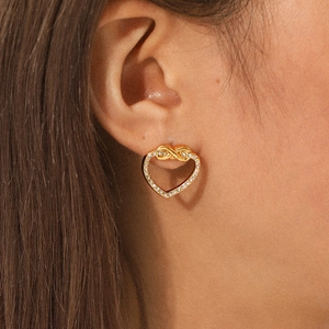Elegant gold heart stud earrings with infinity knot design and sparkling crystals for women
