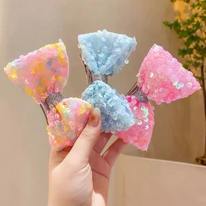Sparkly sequin mermaid style bow hair clips for girls in pink blue and multicolor