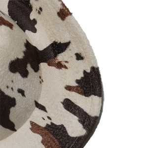 Close-up of the plush cow print fabric and detailed stitching on the wool jazz hat