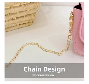 Detail shot of the golden metal chain and smooth pink leather on children crossbody bag