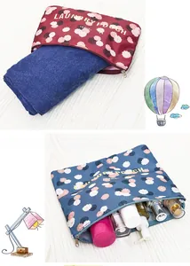 Detail of floral 6-piece travel organizer set showing laundry pouch for clothes and toiletries