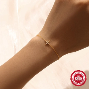 Elegant gold S925 sterling silver thin bracelet featuring a sparkling star charm pendant