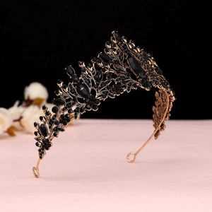 Macro detail of Baroque bridal tiara featuring black rhinestones and leaf motifs