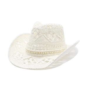 Detail of white crochet cowboy hat featuring elegant pearl bead band and hollow weave