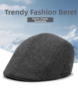 Detailed texture of dark grey herringbone wool blend winter newsboy cap for men