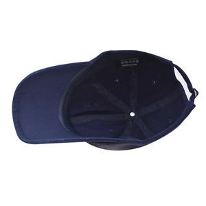 Internal view of navy blue washed cotton baseball cap with sweatband and wash label